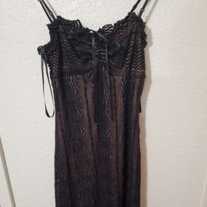 Flirty and cute Black spaghetti strap dress .